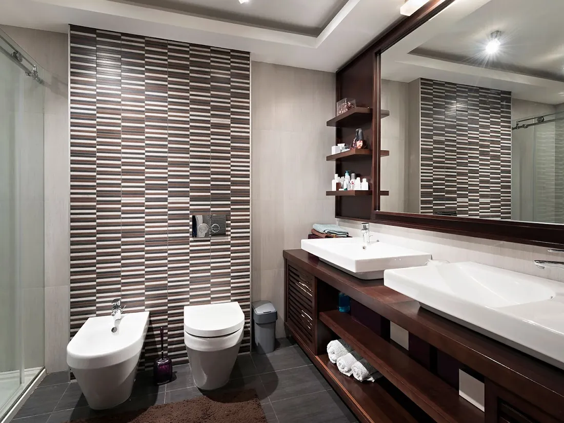 Modern bathroom with mosaic tile wall and double vanity