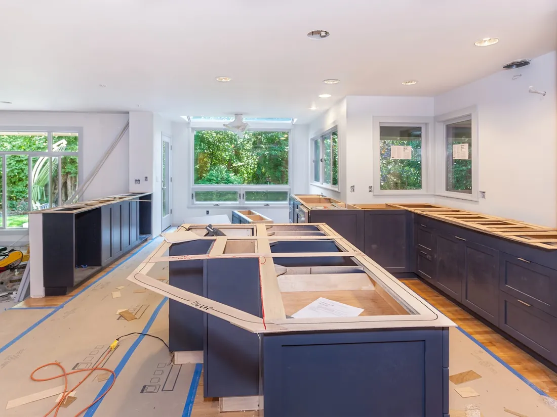 Kitchen remodel in progress with cabinets being installed